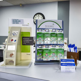 counter showcases hearing aid models and batteries at Bisel Hearing Aid Center